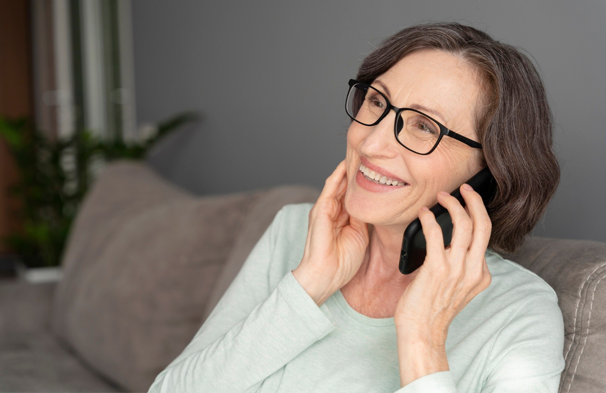 Older woman smiling while talking on the phone